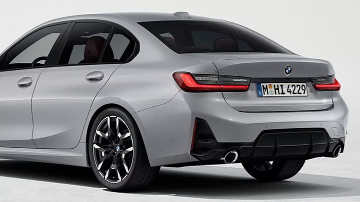 Rear quarter shot of a stationary grey BMW 3 Series saloon