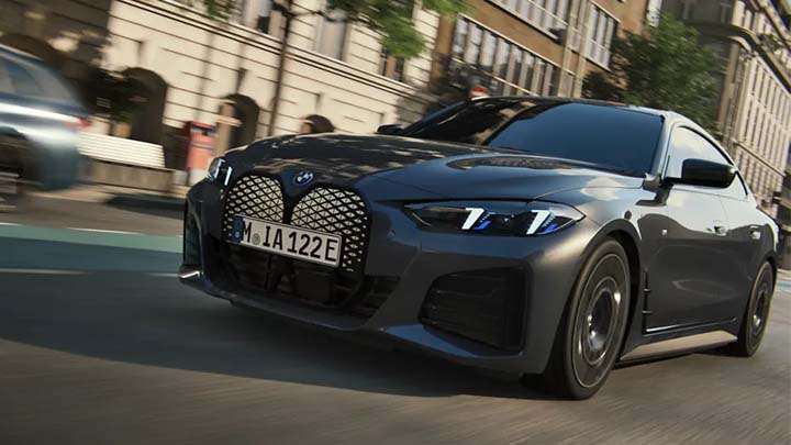 Front quarter shot of a grey BMW i4 driving