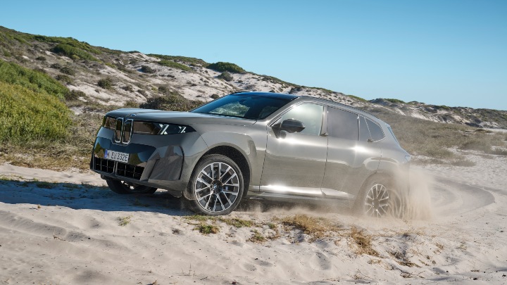 BMW iX5 driving on sand 