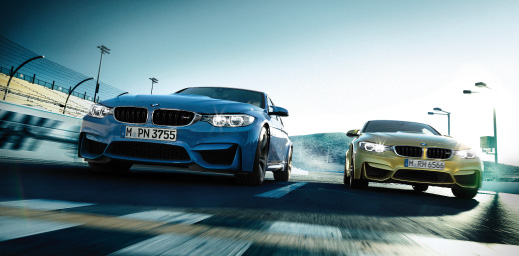 Blue and yellow BMW M Series on the track.