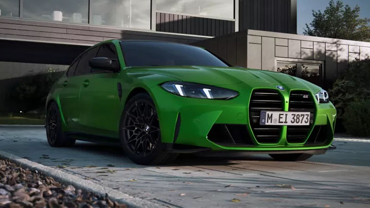 Stationary front quarter shot of a green BMW M3 Competition
