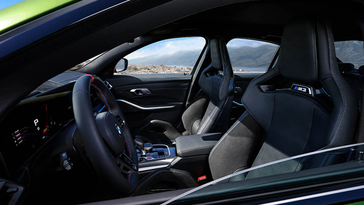 Close up of a BMW M3 Competition's sport seats and interior