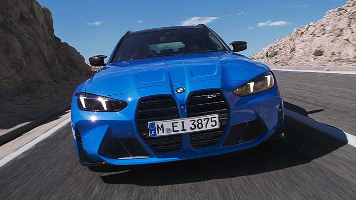 Close up of a blue BMW M3 Touring's front grille and bumper