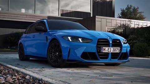 Stationary front quarter shot of a blue BMW M3 Touring