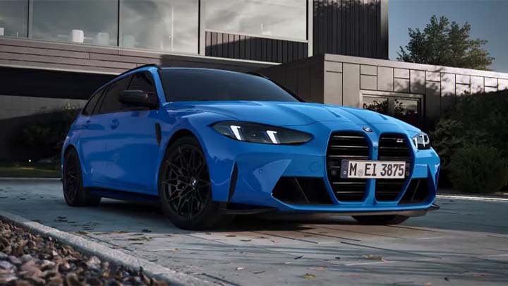 Stationary front quarter shot of a blue BMW M3 Touring