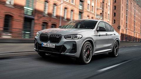 Grey BMW X4, driving in the city