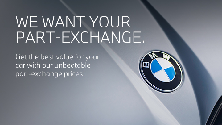 A grey BMW with logo in the focus. White promotional text overlay.