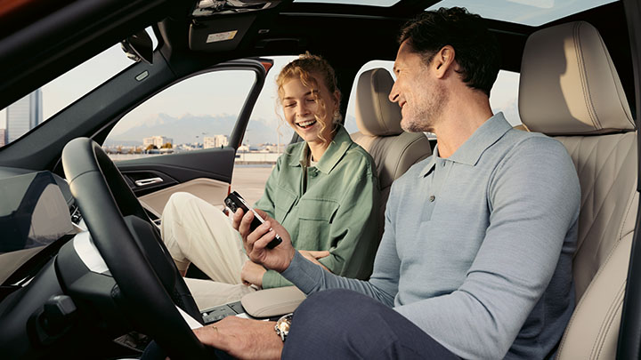 Man and Woman Sitting In BMW