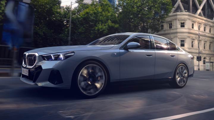 Side Shot of Grey BMW i5 Driving
