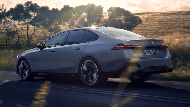 Rear Shot of Grey BMW i5 Driving