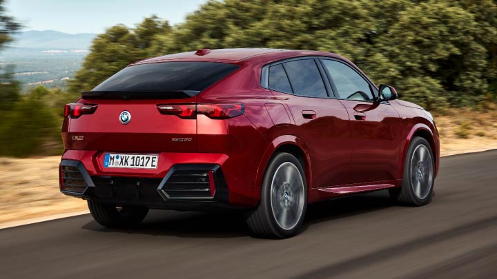 Red BMW iX2 Rear Driving