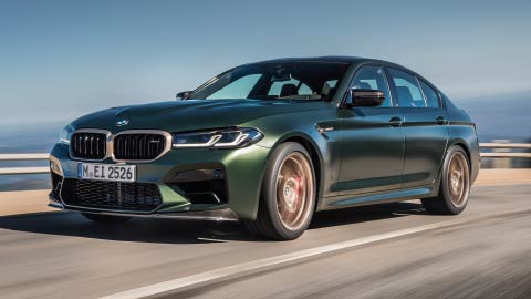 Green BMW M5 CS Driving On Mountain Road
