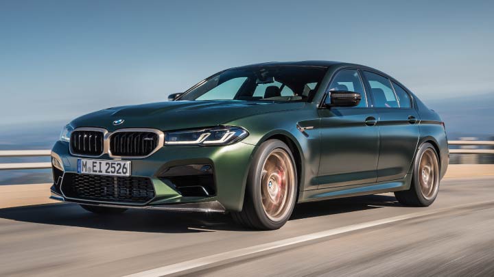 Green BMW M5 CS Driving On Mountain Road
