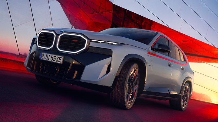 BMW XM driving on a bridge