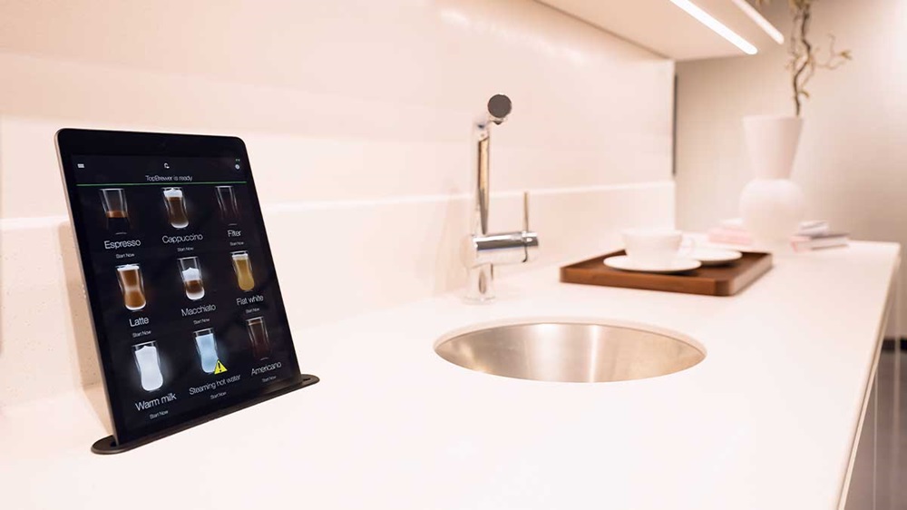 Stratstone Land Rover Mayfair, interior shot with coffee lounge area and tablet