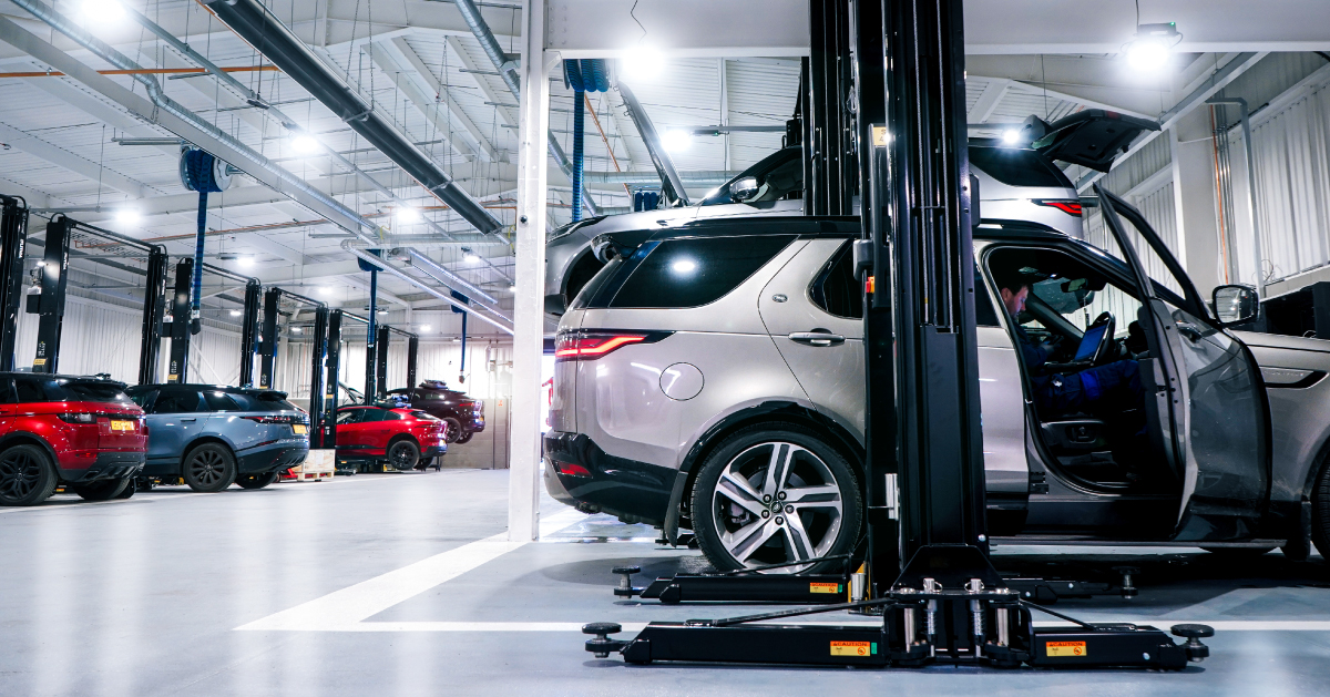 Land Rover Vehicle On Ramp In Workshop