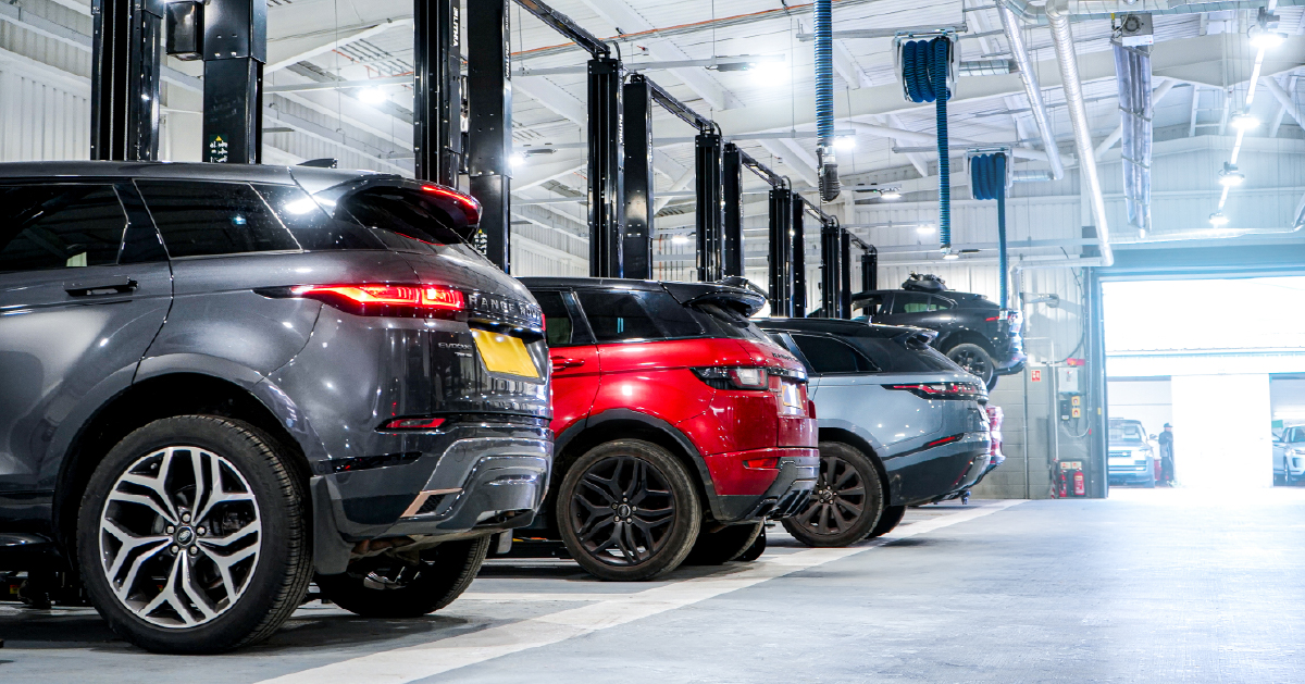 Land Rover Vehicles Lined Up In Workshop