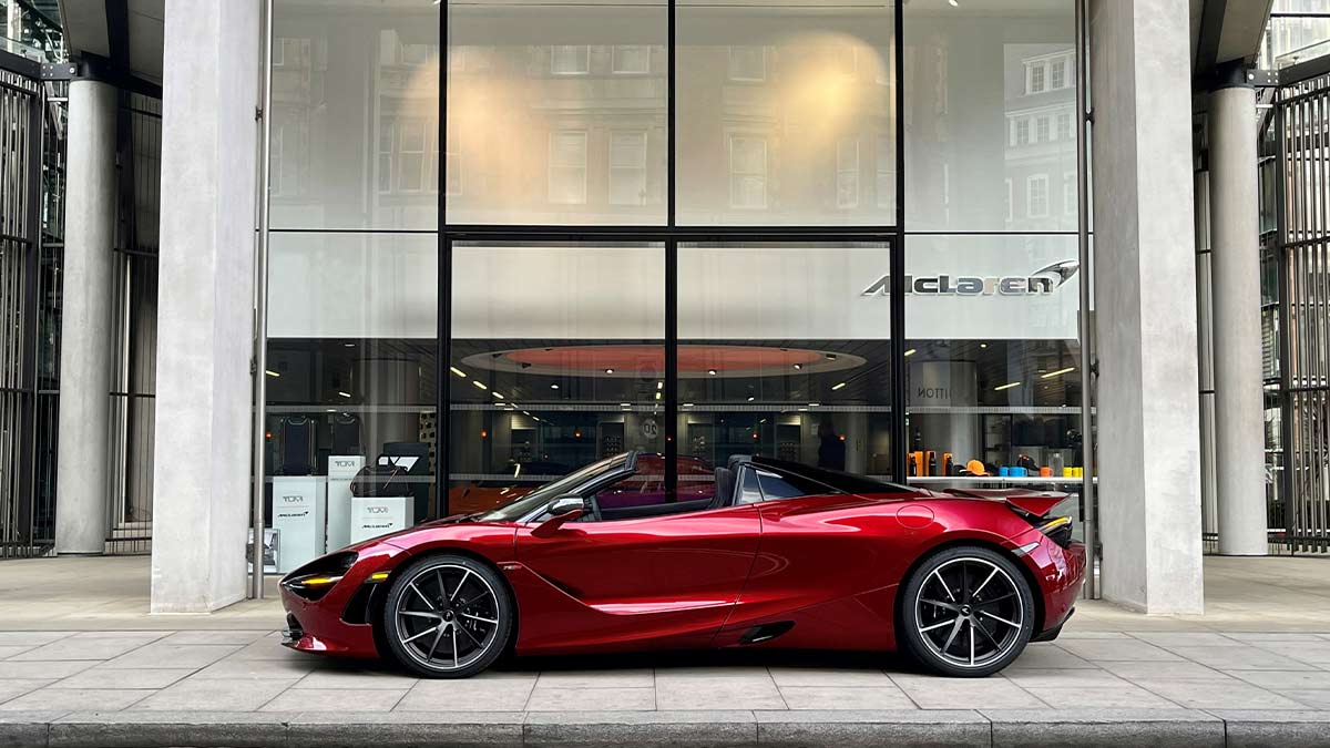 Red McLaren parked outside the front of Stratstone McLaren London