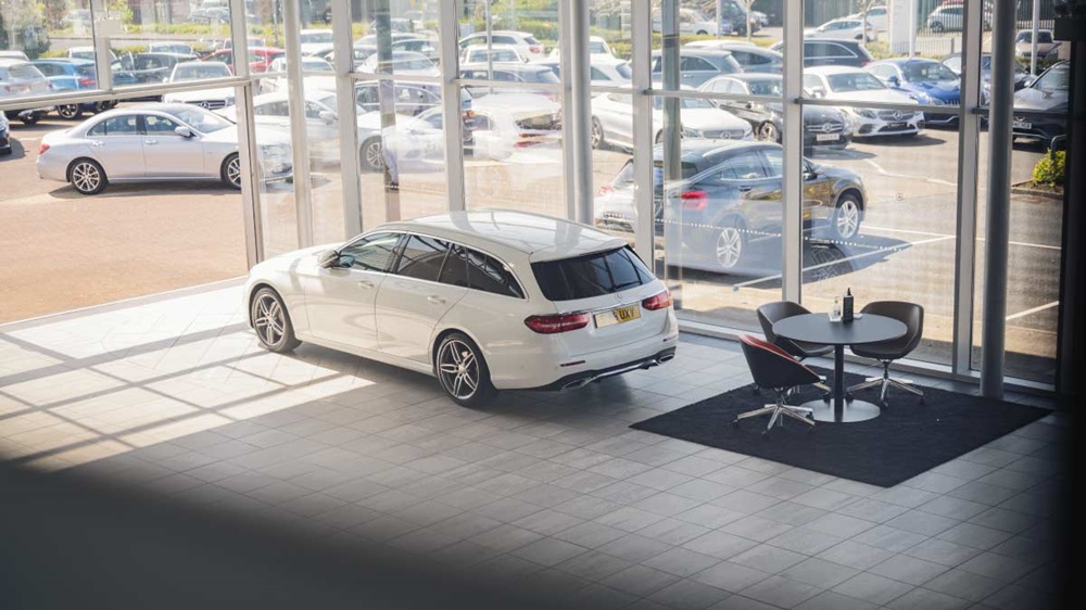 Mercedes of Ayr showroom with white Mercedes-Benz estate