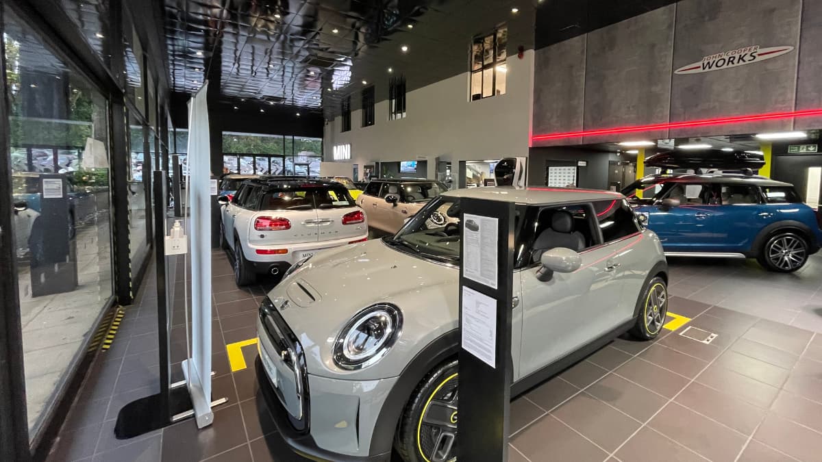 Wide angle image of Stratstone MINI Harrogate showroom and the cars