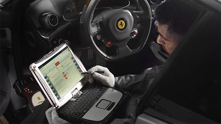 Ferrari Technician completing diagnostics on a Ferrari