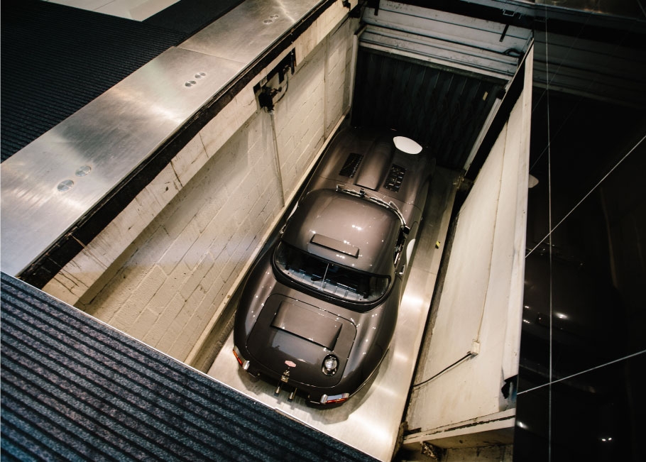 Lightweight E-type descends into the depths of Stratstone's Mayfair Basement.