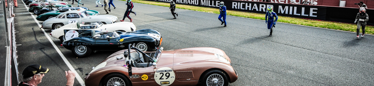 Cars lined up at Le Mans.