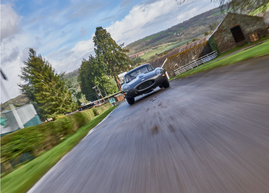 Jaguar Lightweight E-Type driving on the Shelsley Walsh track.