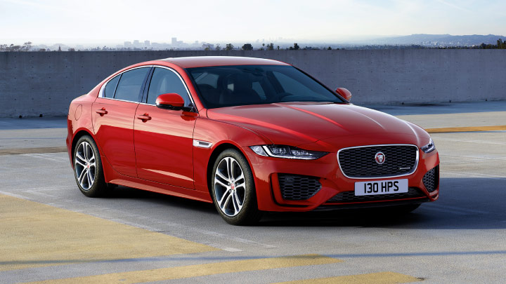 Jaguar XE in red parked.