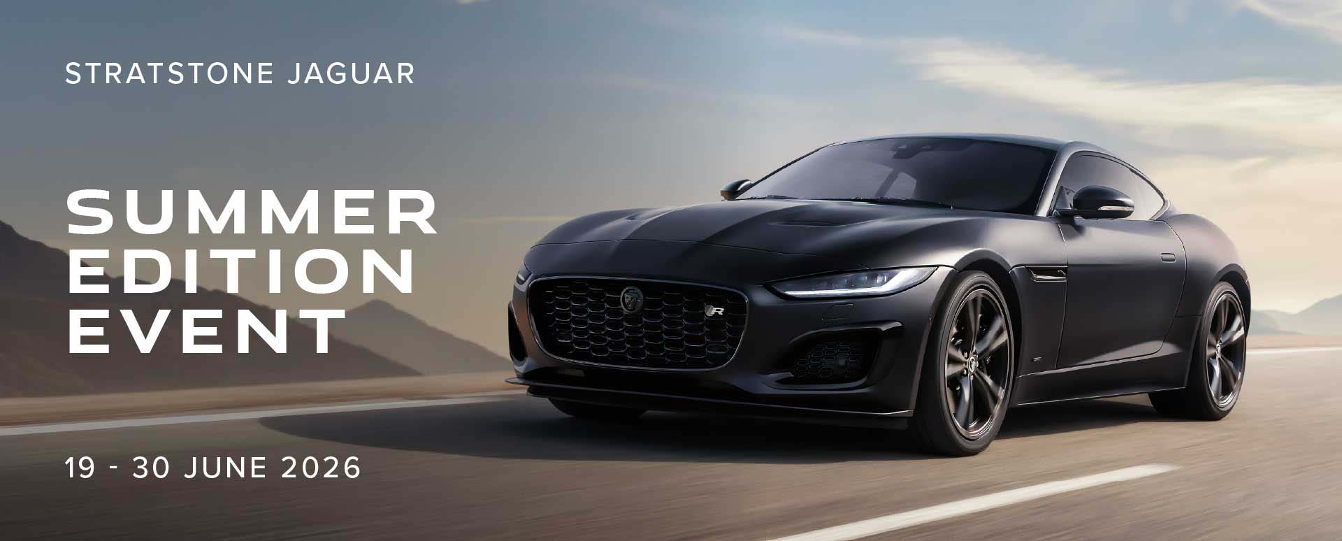 Black Jaguar Driving On Road