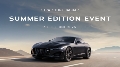 Black Jaguar Driving On Road