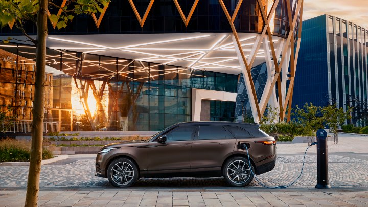 Brown Range Rover Velar on Charge at Public Charging Station