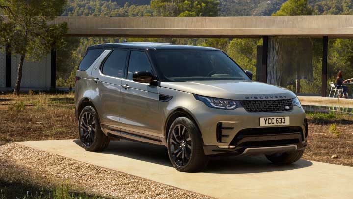 Land Rover Discovery in silver parked up.