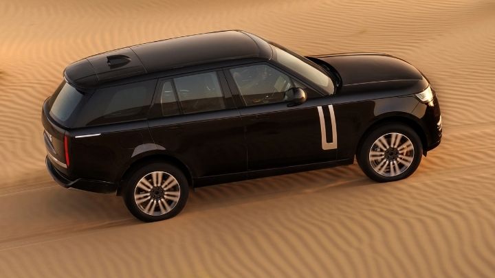 Range Rover Electric being driven in the dunes