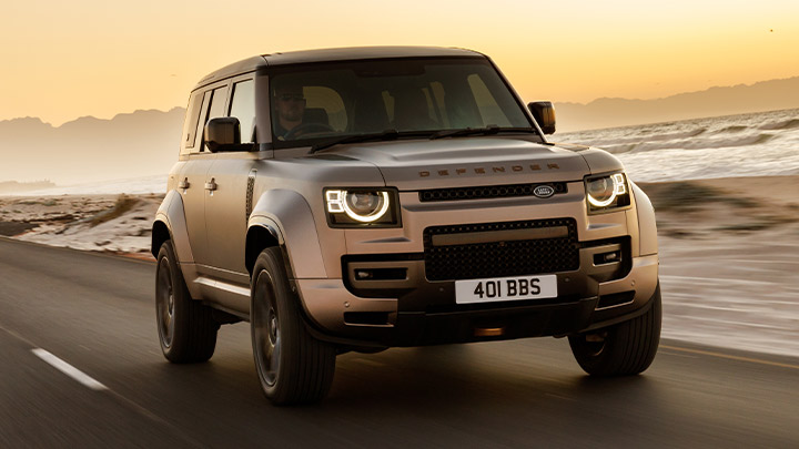 Silver Land Rover Defender Octa driving