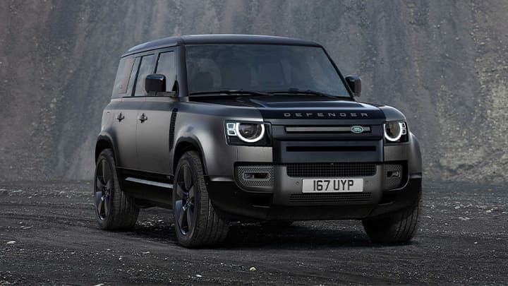 Black Land Rover Defender 110 render shot with mountain in background