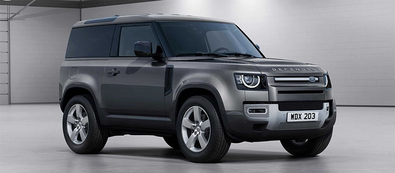 Grey Land Rover Defender, plain background studio shot