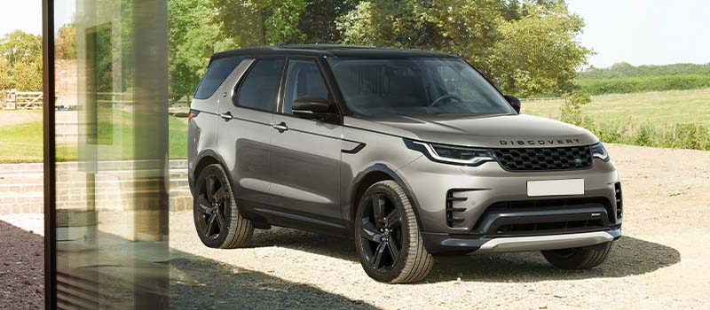 Land Rover Discovery Commercial parked outside building site