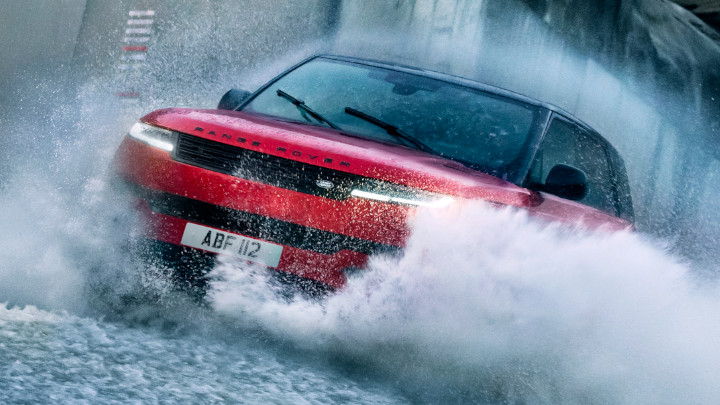 Red Range Rover Sport Driving Through Water Splash