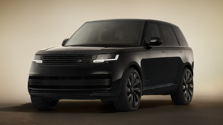 Front view of a black Range Rover SV Black luxury SUV on a studio background