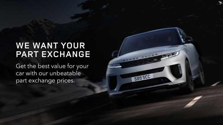 Silver Land Rover Driving on Road