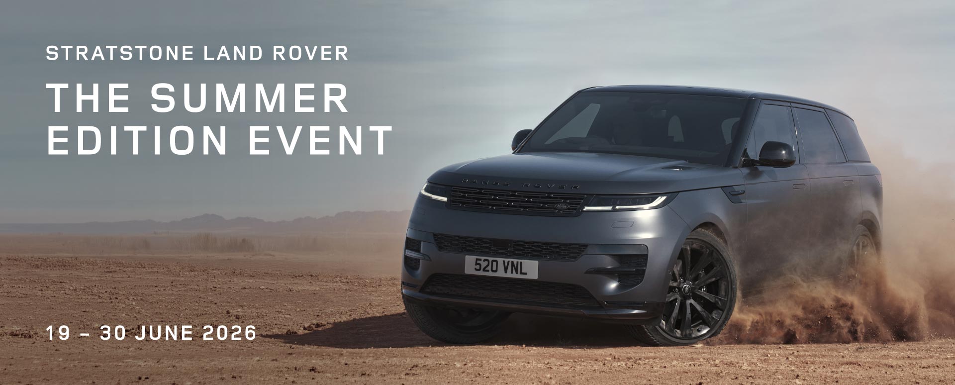 Grey Range Rover drifting on a deserted landscape. White promotional text overlay.