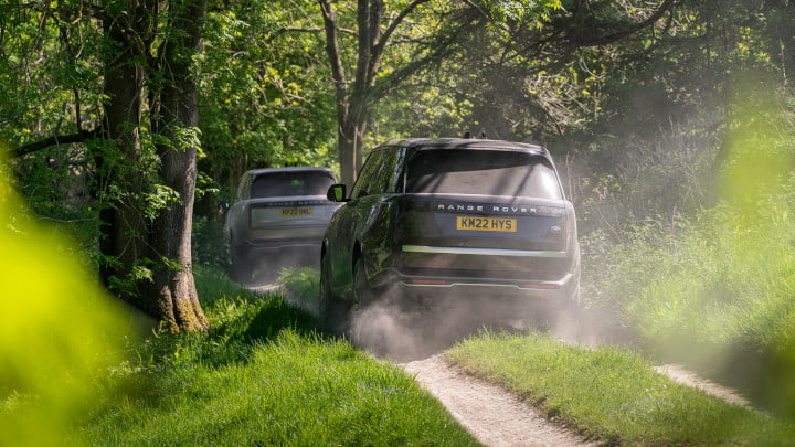 Duo of Range Rover Models Off-Roading in Forest