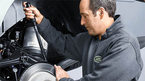 land rover technician completing a brake repair