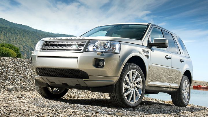 Silver Land Rover Freelander driving in the mountains