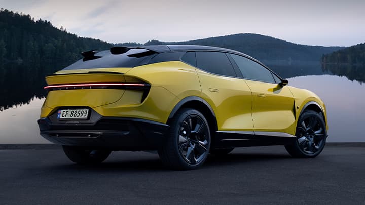 Rear quarter shot of a parked yellow Lotus Eletre