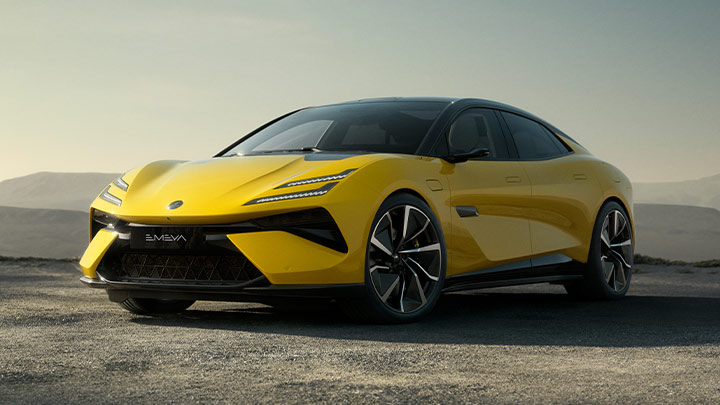 Front quarter parked shot of a yellow Lotus Emeya