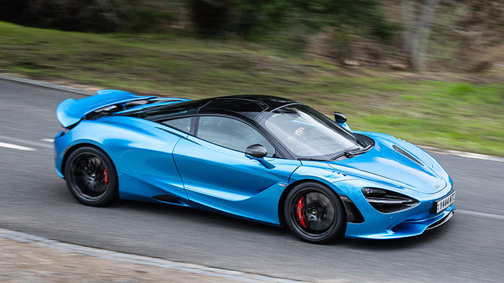 Blue McLaren 750S Driving On Road