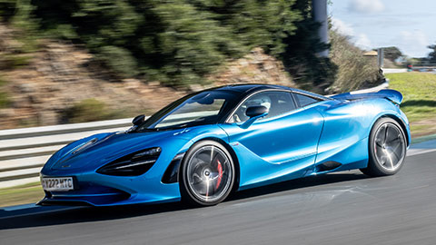 Blue McLaren 750S Driving On Road