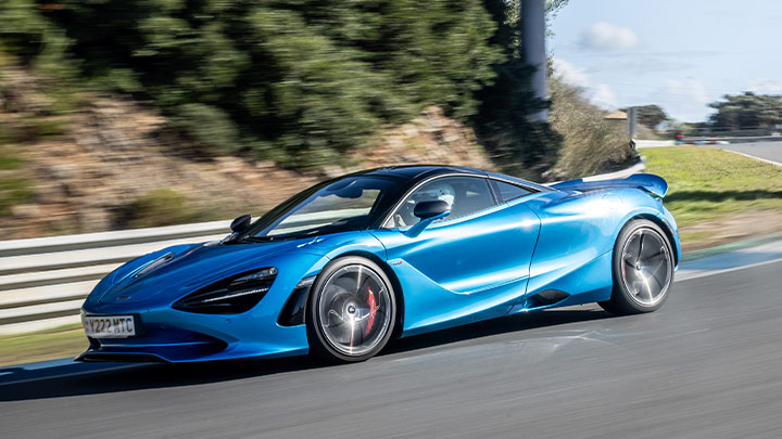 Blue McLaren 750S Driving On Road